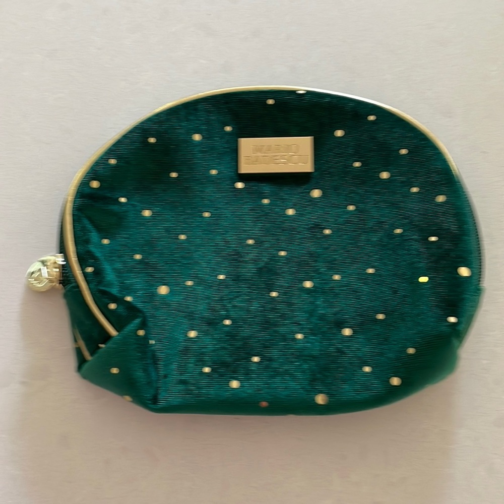 Green velvet handbag with gold polkadots
